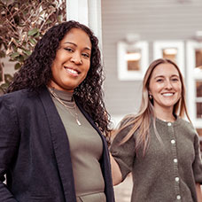 Two women smiling. Links to Gifts of Life Insurance