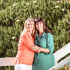 Two women smiling. Links to Gifts That Protect Your Assets